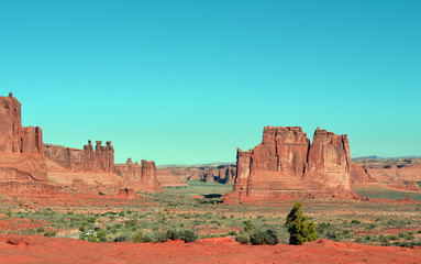 Fototapeta na wymiar Red geological Formations/Tall red geological formations in the Utah Desert