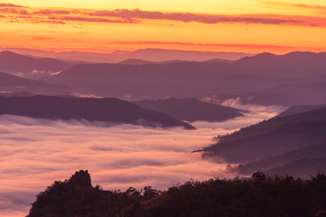 Morning scene of fog on high hill landscape along the valley and sunrise atmosphere from mountain peak.