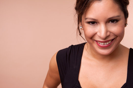 Beautiful Hispanic Woman Isolated On A Solid Background.