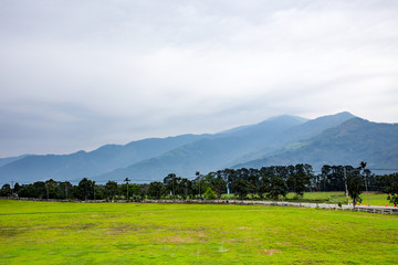 Landscape of beautiful mountain and grassland under sky in Taitung, Taiwan, Asia.Chu lu ranch in Beinan, Taiwan.