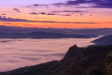 Morning scene of fog on high hill landscape along the valley and sunrise atmosphere from mountain peak.