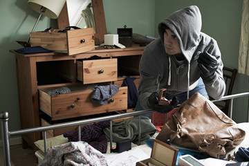 Burglar Stealing Items From Bedroom During Hose Break In