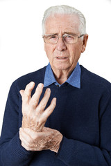 Portrait Of Senior Man Suffering With Arthritis