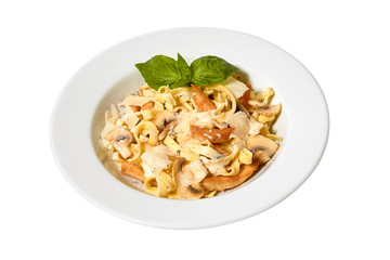 Pasta, baked chicken, fried leek, green peas, spinach, cheese, sauce.  Isolated on the white background