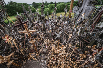 Heap of crosses on so called Hill of Crosses in Lithuania