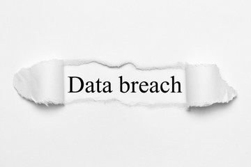 Data breach on white torn paper