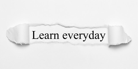 Obraz premium Learn everyday on white torn paper