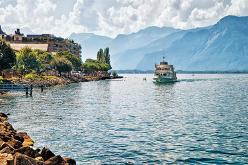 Fototapeta na wymiar Excursion ship with people aboard on Geneva Lake at Montreux