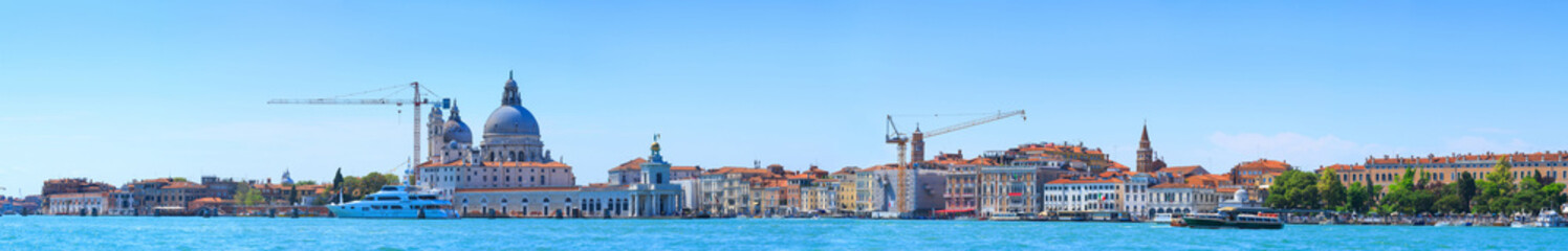 Fototapeta na wymiar Panoramic cityscape beautiful ancient town. Venice, laguna view on Basilica di Santa Maria della Salute. Venice, Italy.