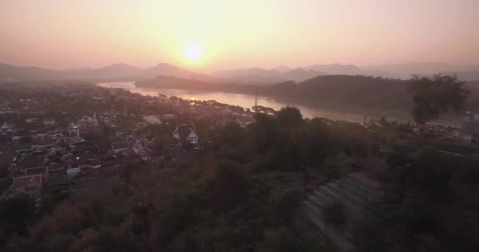Sunset Over Luang Prabang And Mount Phousi, Laos, Aerial Reveal Shot
