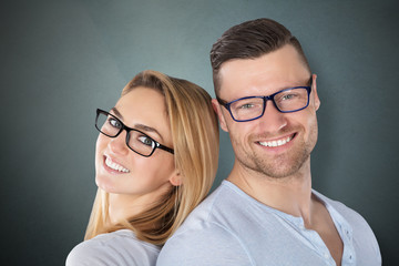 Happy Couple With Stylish Eyeglasses