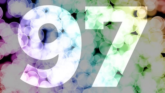 Ninety seven to ninety eight years birthday fade in/out animation with color gradient moving bokeh background. Animation: 90 frames still with number, 180 fade out, 30 clear, 180 fade in, 300 still.