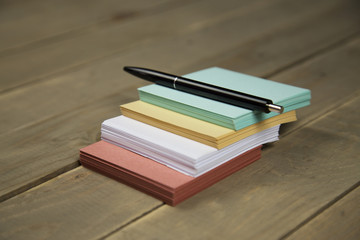 note on wood background with pen