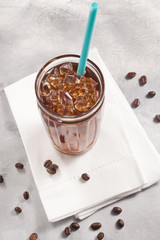 Cold brew coffee and coffee beans.
