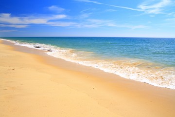 Fototapeta na wymiar Sandy beach in Algarve region, Portugal