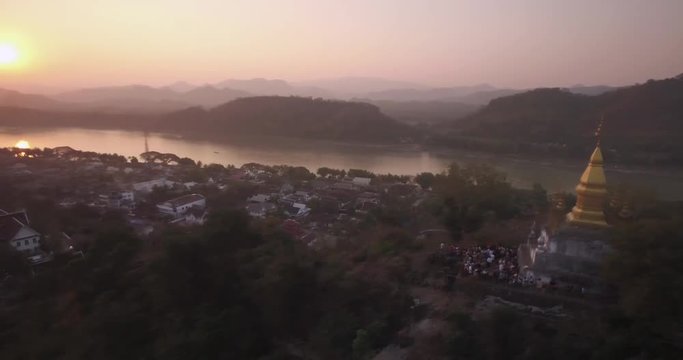 Tourists Watching Sunset On Mount Phousi, Luang Prabang, Laos, Aerial Shot
