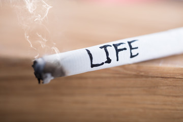 Life Word Written On Burning Cigarette