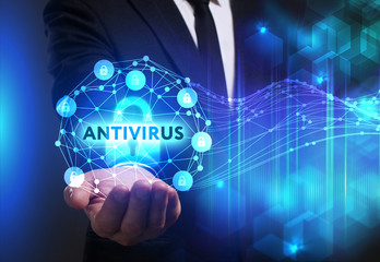 Business, Technology, Internet and network concept. Young businessman working on a virtual screen of the future and sees the inscription: Antivirus