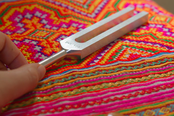tuning fork and crystal on table .
