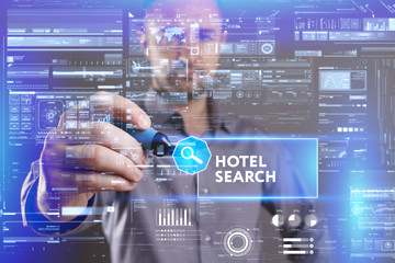 Business, Technology, Internet and network concept. Young businessman working on a virtual screen of the future and sees the inscription: Hotel search