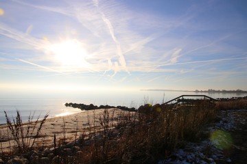 Fototapeta premium Atmosphere on the sandy beach in February so lovely