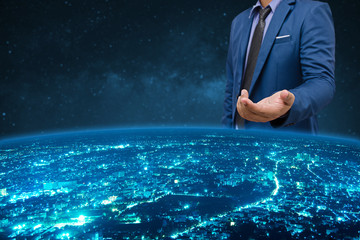 Fototapeta premium businessman in blue suite with welcome hand over the world