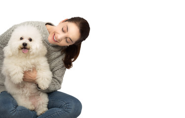 Woman with bichon frise dog.