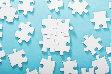 White Jigsaw Puzzles On Blue Background