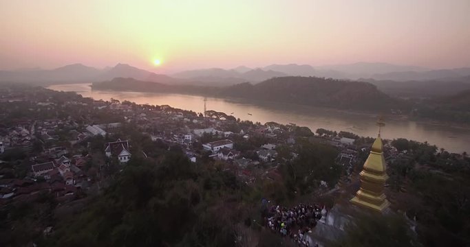 Tourists on Mount Phousi Watching Sunset, Luang Prabang, Laos, Pullback Reveal
