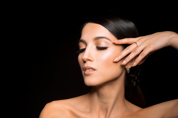 Portrait of Young Beautiful Japanese Woman with Bright Make Up, Long Hair, Clean Skin and big Eyes. Fashionable Poses in Studio on Black Background. Close Up