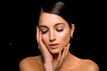 Portrait of Young Beautiful Japanese Woman with Bright Make Up, Long Hair, Clean Skin and big Eyes. Fashionable Poses in Studio on Black Background. Close Up