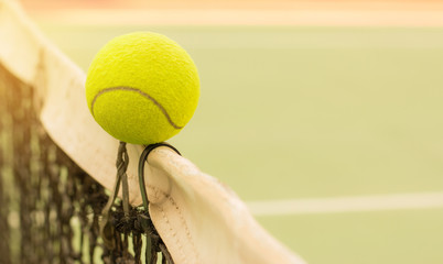 Tennis ball hitting the old net