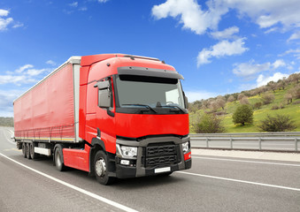 Fototapeta na wymiar Red Truck On The Highway