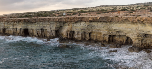 Panorama of sea caves and Mediterranean at sunset. Cape Greko, Cyprus. 
