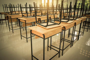School classroom with desks and chair iron, wood, in high school thailand, vintage tone education concept