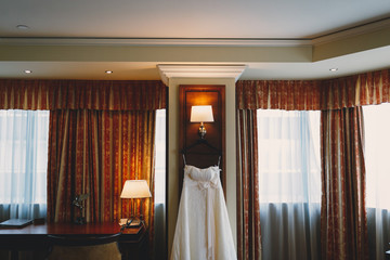 Fototapeta na wymiar Bride wedding dress in hotel room