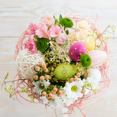 Easter bouquet of fresh flowers with eggs top view