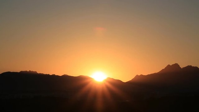 Time lapse of beautiful sunrise over mountain 