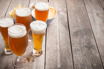 glass beer on wood background