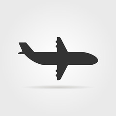 black airplane icon side view with shadow