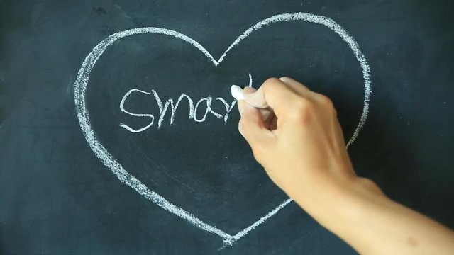 Chalk drawing - Smart phone in heart shape on chalkboard 