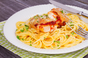 Chicken parmesan and pasta. Chicken breasts and spaghetti