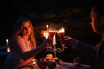 Glasses by candlelight during a dinner outdoors