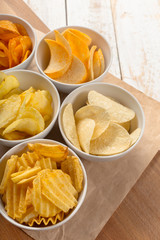 Pretzels in bowls on wooden table from above