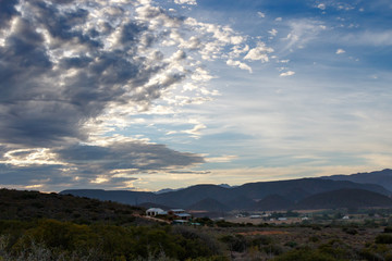 Obraz premium Houses on the hill on a cloudy day