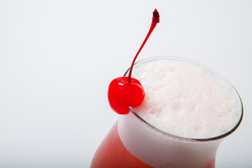 colourful coctail with cherry on the black background