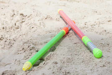 Sword toy on the sand at the beach.