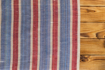 Background with empty wooden table with tablecloth