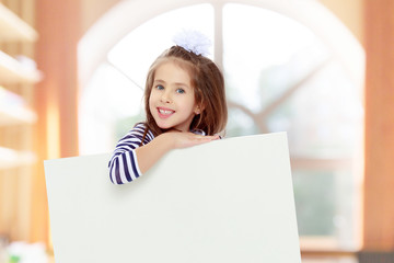 Little girl in a striped dress.