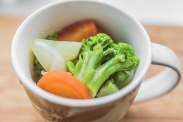 Vegetables: carrots, broccoli, onions, potatoes.